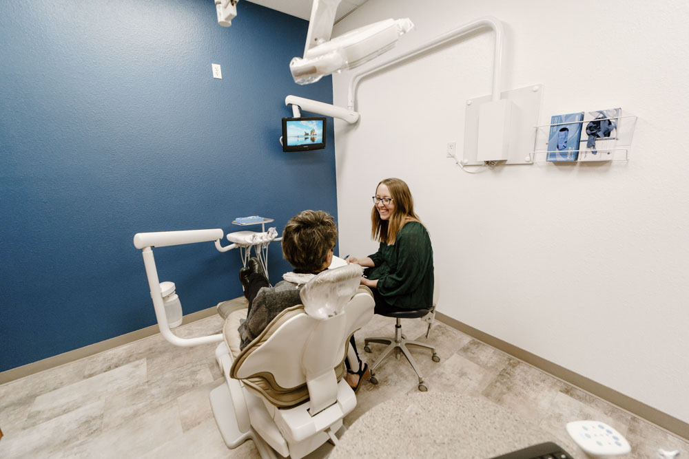 Dental hygienist speaking with a patient