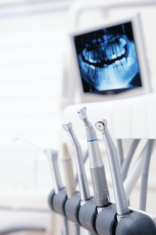 dental tools and an x-ray