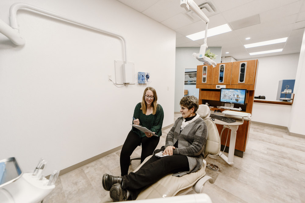 Dental Hygienist speaking with a patient